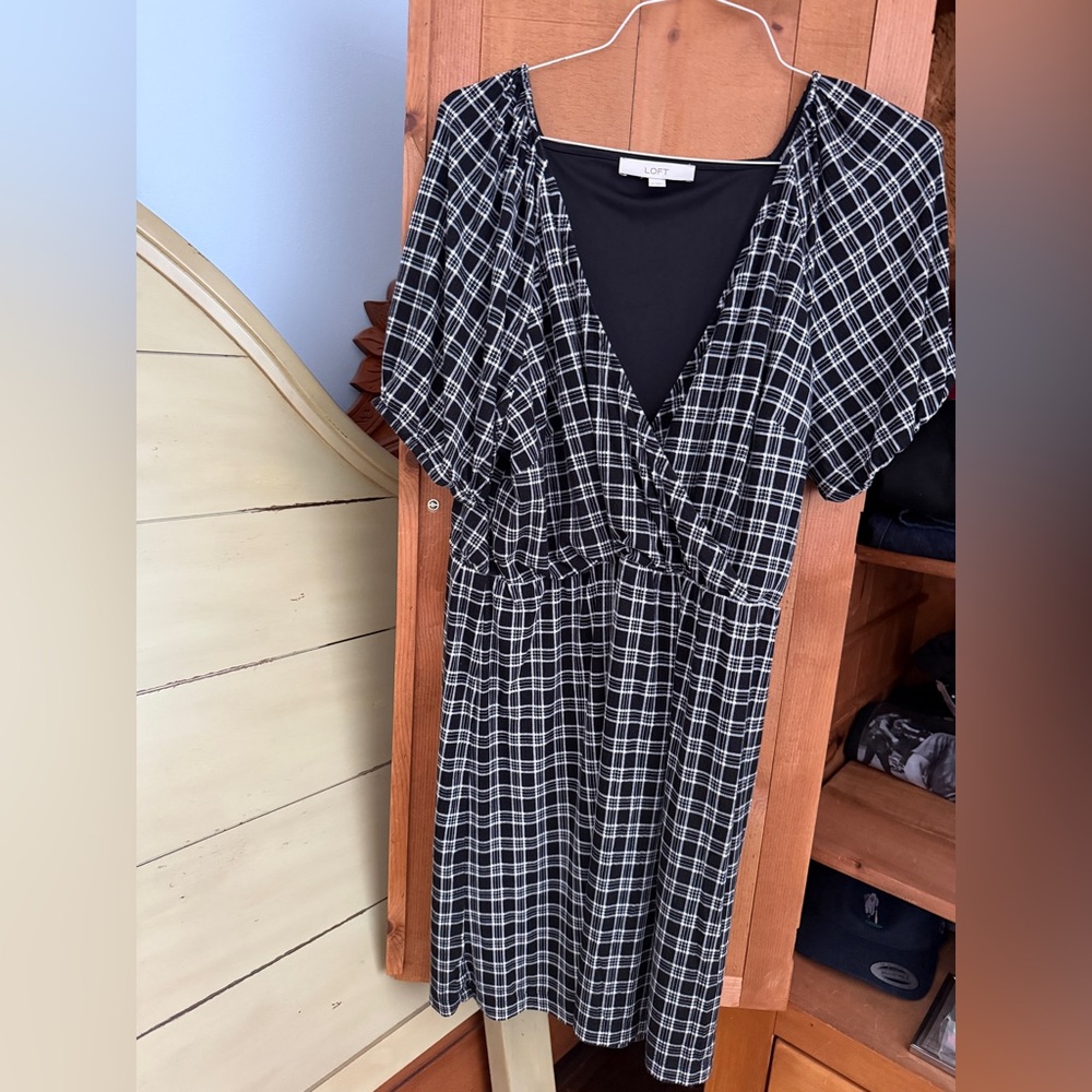Casual dress with faux wrap style. Non wrinkle